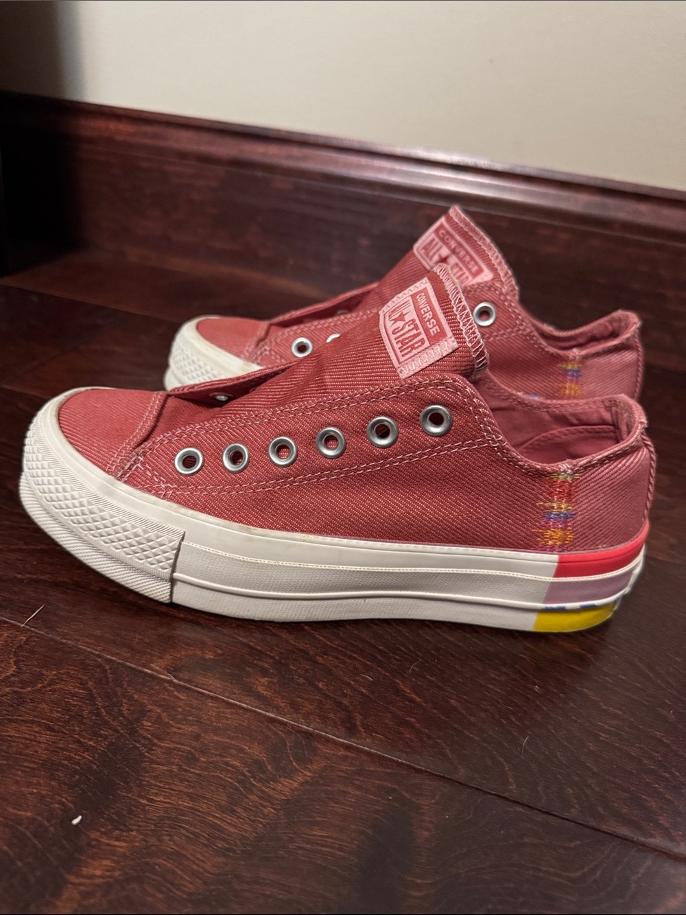 Converse Low-Top Slip-On Sneakers in Brick Red with Multicolor Heel Accents